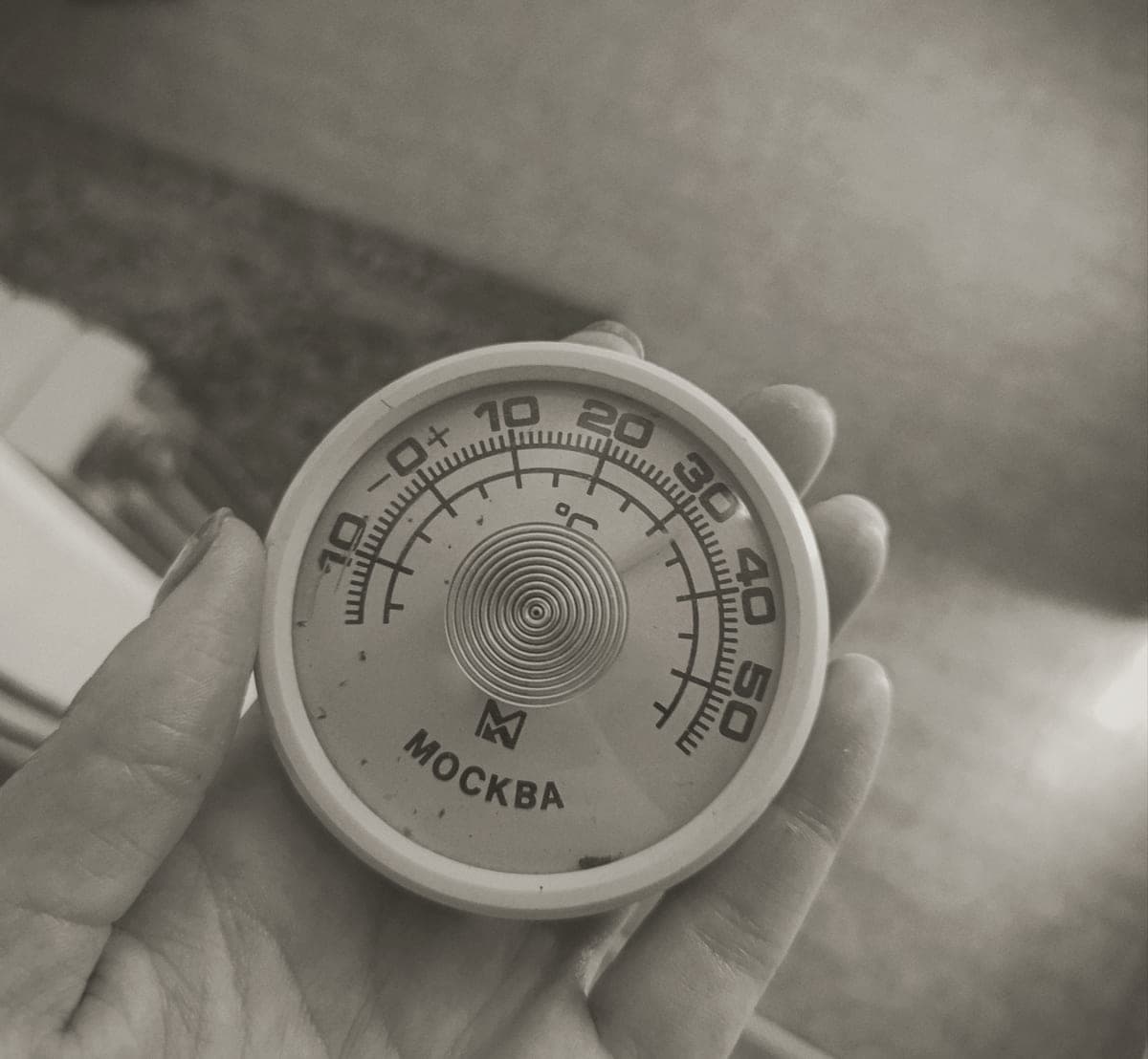 A thermometer reading the temperature of aquarium water