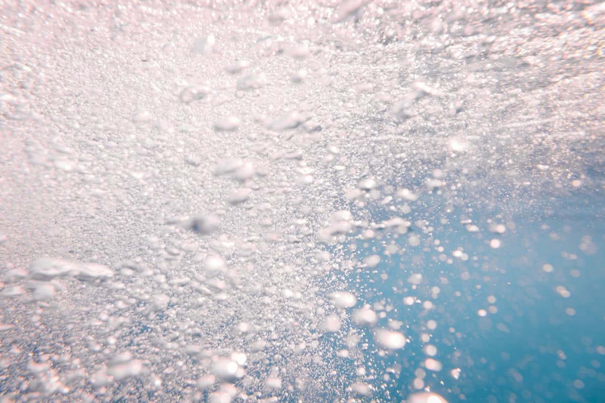 Close-up of air bubbles rising through water